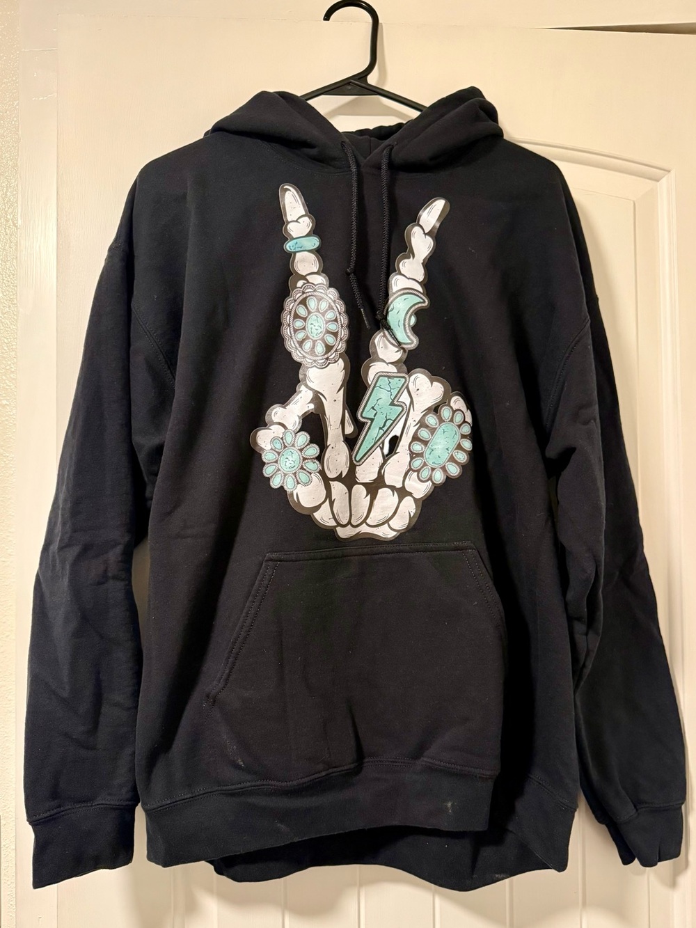 Black Hoodie with Turquoise Western Accented Skeleton Hand Graphic